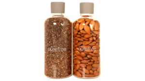 2 Glass storage and display bottle 500ml, with food grade silicon lids. Bottles contain nuts and chia seeds. Use for pantry or display in kitchen