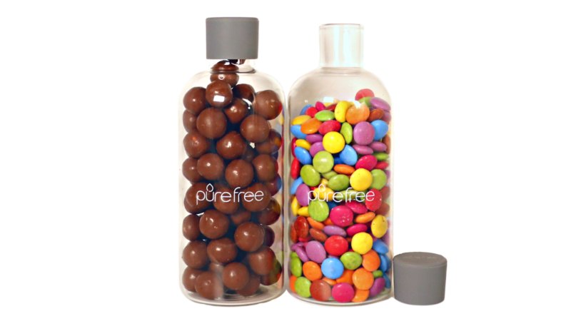 2 Glass storage and display bottles, each 500ml capacity, with food grade silicon lids. Bottles contain smarties and maltesters, lollies. Use for pantry storage or display in kitchen. Easily and quickly access lollies and treats for Christmas or celebrations. PIctured with one bottle lid off so you can see neck of bottle
