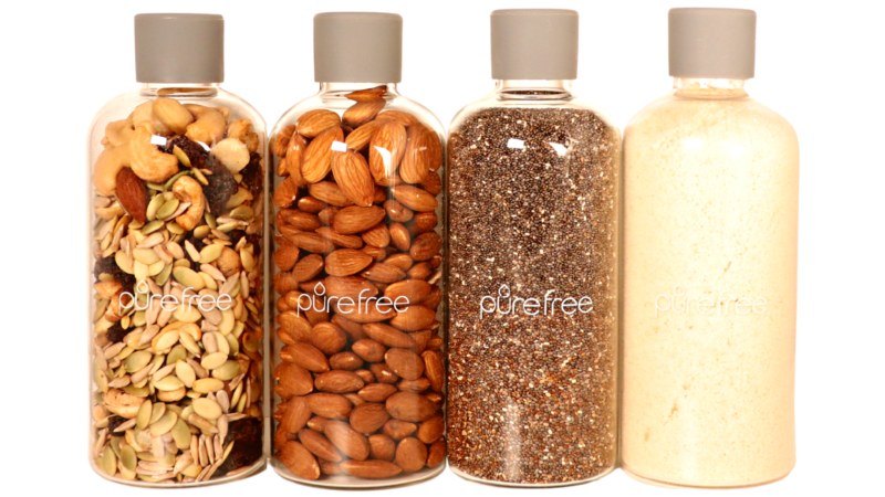 4 Glass storage and display bottles, each 500ml capacity, with food grade silicon lids. Bottles contain seeds, nuts, almond meal, trail mix. Use for pantry storage or display in kitchen. Easily and quickly access nuts, seeds, breakfast additions. Or lollies and treats for Christmas or celebrations
